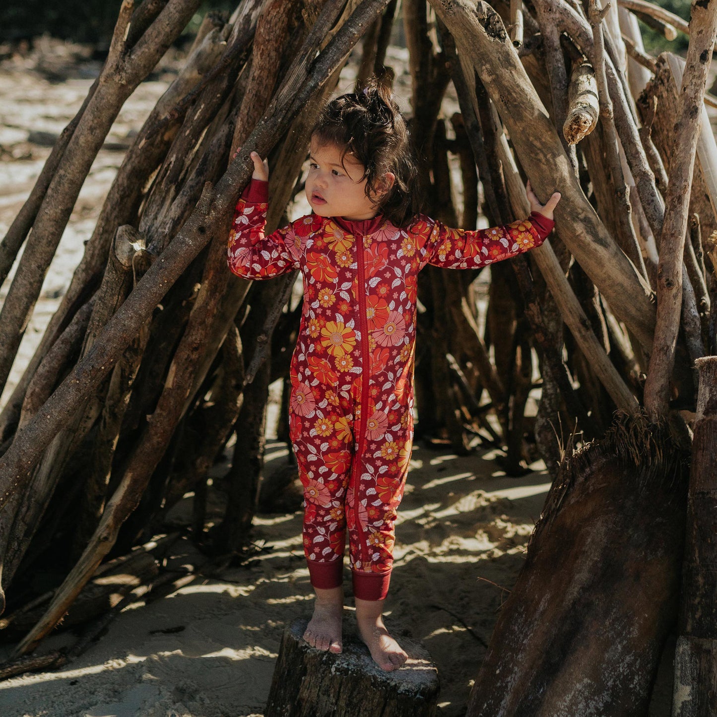 Toddler wearing Pipi Swimwear floral full length sunsuit